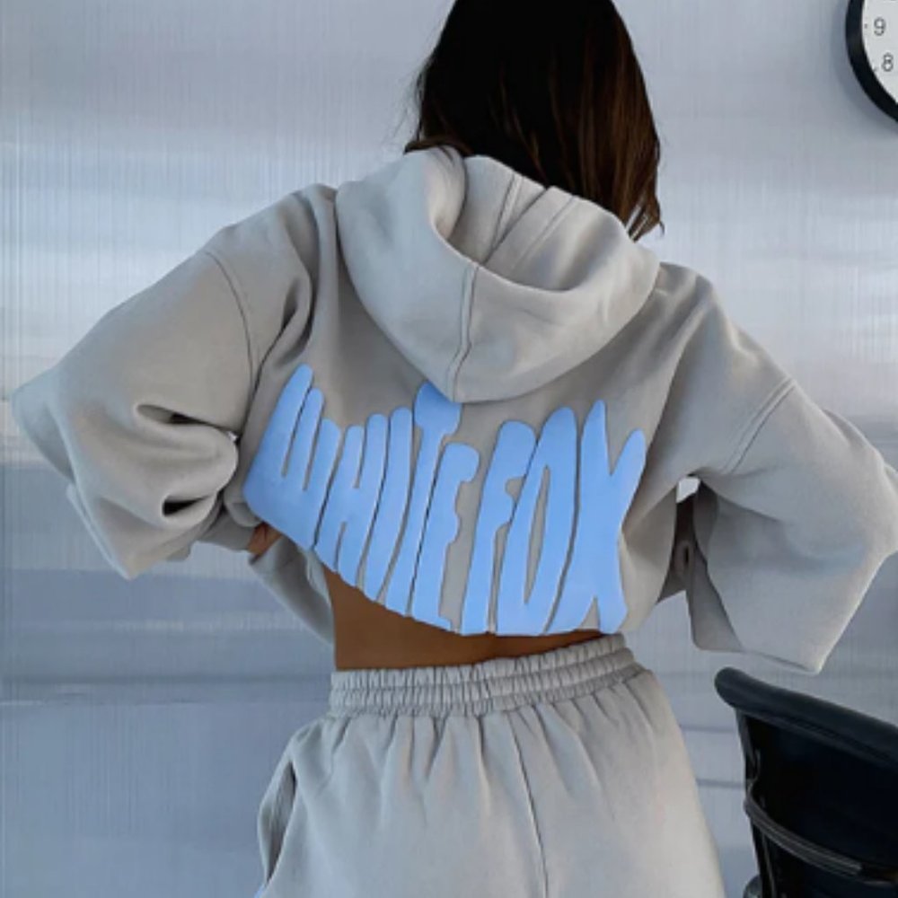 White Fox Boutique Cropped Hooded Sweatshirt in Light Gray with Pale Blue Logo